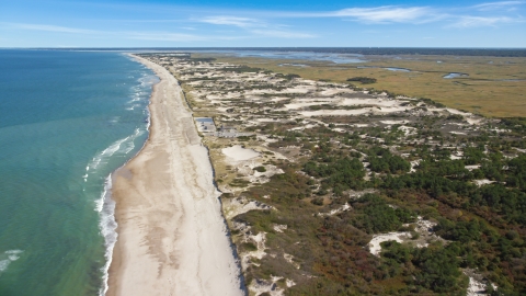 AX143_132.0000000 - Aerial stock photo of A beach and nearby sand dunes, Barnstable, Massachusetts