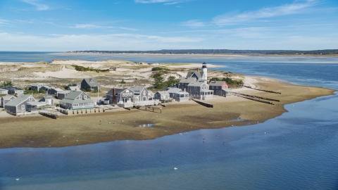 AX143_143.0000261 - Aerial stock photo of Small town of Sandy Neck Colony and Sandy Neck Light on Cape Cod, Barnstable, Massachusetts