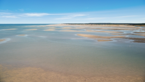 AX143_146.0000309 - Aerial stock photo of Sand bars at low tide on Cape Cod Bay, Massachusetts