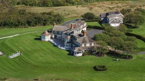 AX143_160.0000204 - Aerial stock photo of A large mansion on Cape Cod, Dennis, Massachusetts