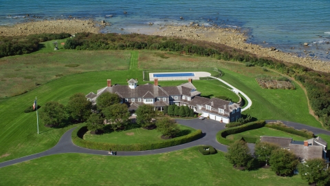 AX143_162.0000193 - Aerial stock photo of A mansion with green lawns on Cape Cod, Dennis, Massachusetts