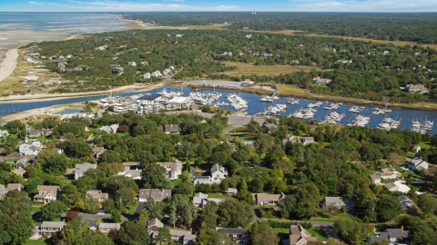AX143_163.0000000 - Aerial stock photo of Sesuit Harbor and marina on Cape Cod, Dennis, Massachusetts