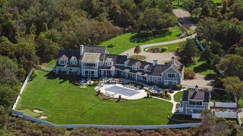 AX143_167.0000143 - Aerial stock photo of A spacious mansion with green lawns on Cape Cod, Dennis, Massachusetts