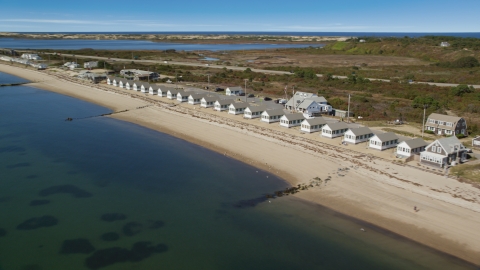AX143_214.0000246 - Aerial stock photo of Beachside cottages on Cape Cod, Truro, Massachusetts