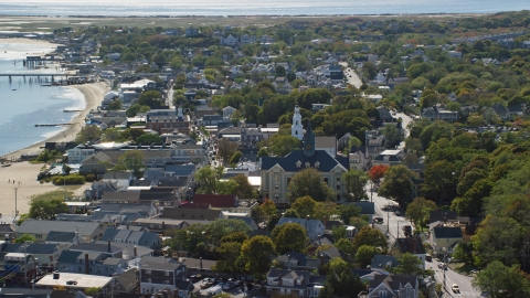 AX143_229.0000310 - Aerial stock photo of Provincetown Town Hall and Unitarian Universalist Meeting House in the coastal town of Provincetown, Massachusetts