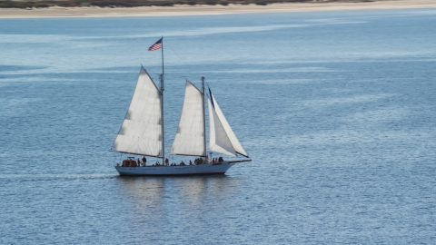 AX143_243.0000000 - Aerial stock photo of A sailing boat on Cape Cod Bay, Massachusetts