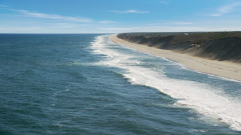 AX144_025.0000081 - Aerial stock photo of Ocean waves rolling onto a beach, Cape Cod, Wellfleet, Massachusetts