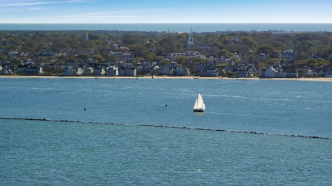 AX144_074.0000000 - Aerial stock photo of A small island town, sailboats on water, Nantucket, Massachusetts