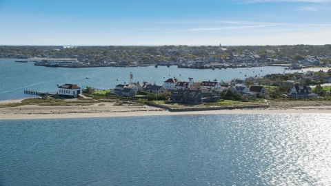 AX144_076.0000000 - Aerial stock photo of Beachfront property by Nantucket Harbor Range Lights, Nantucket, Massachusetts