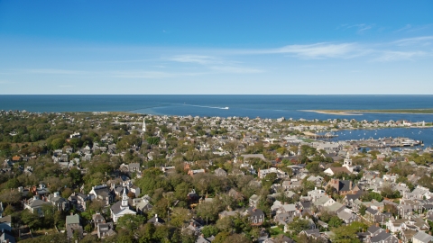 AX144_097.0000000 - Aerial stock photo of A small coastal community with a view of Nantucket Harbor, Nantucket, Massachusetts