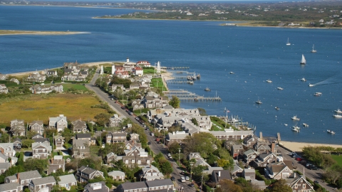 AX144_103.0000129 - Aerial stock photo of Coastal homes by Nantucket Harbor Range Lights, Nantucket, Massachusetts