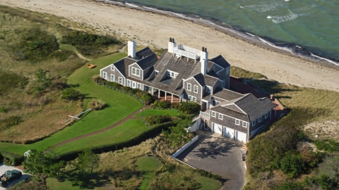 AX144_107.0000277 - Aerial stock photo of An upscale beachfront home in Nantucket, Massachusetts