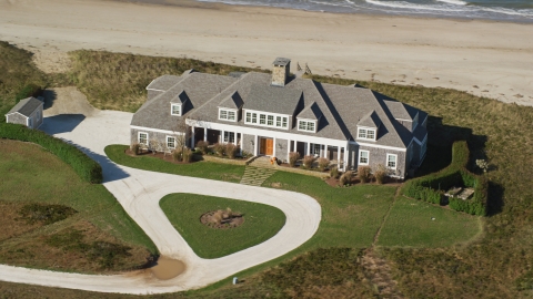 AX144_111.0000154 - Aerial stock photo of A beautiful home by the beach in Nantucket, Massachusetts