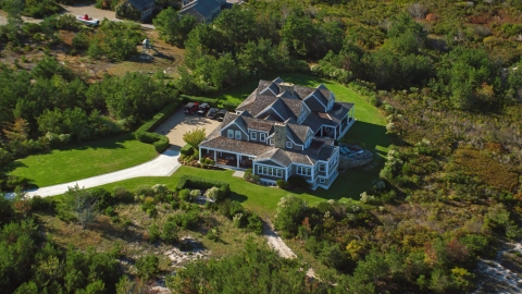 AX144_114.0000020 - Aerial stock photo of An upscale home and green trees, Nantucket, Massachusetts