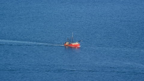 AX144_181.0000000 - Aerial stock photo of A fishing boat sailing on the Atlantic Ocean