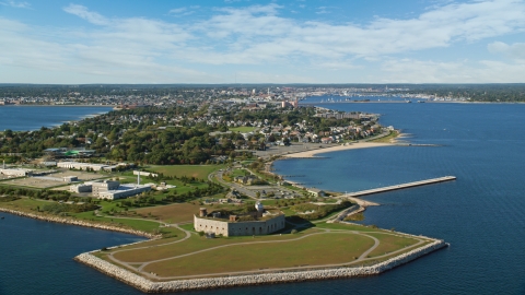 AX144_186.0000268 - Aerial stock photo of Fort Taber by a water treatment plant in New Bedford, Massachusetts