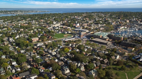 AX144_230.0000305 - Aerial stock photo of A baseball field surrounded by the coastal community of Newport, Rhode Island