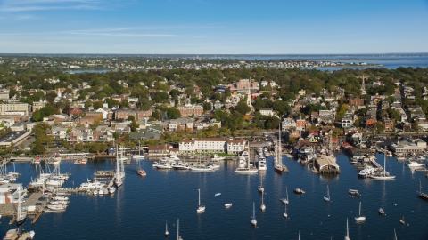 AX144_232.0000172 - Aerial stock photo of Boats docked at piers in the busy harbor in Newport, Rhode Island