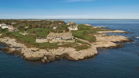 AX144_252.0000017 - Aerial stock photo of An oceanfront mansion beside coastal cliffs, Newport, Rhode Island