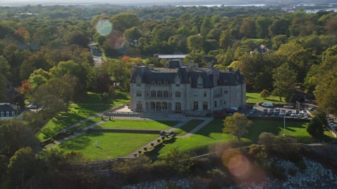 AX144_258.0000091 - Aerial stock photo of Ochre Court, an oceanfront mansion in Newport, Rhode Island