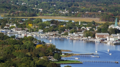 AX145_016.0000312 - Aerial stock photo of A small coastal town, waterfront properties, and sailboats, Warren, Rhode Island