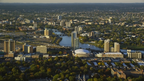 AX146_014.0000053F - Aerial stock photo of Agganis Arena, apartments, and the Charles River, Boston, Massachusetts, sunset