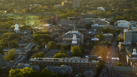 AX146_026.0000281F - Aerial stock photo of A view of Harvard University buildings at sunset in Cambridge, Massachusetts