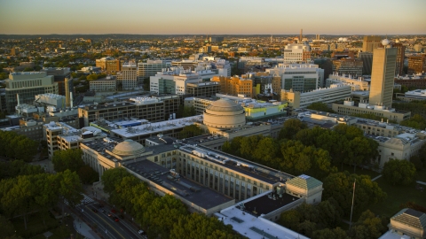 AX146_052.0000236F - Aerial stock photo of The Maclaurin Building at the Massachusetts Institute of Technology, Massachusetts, sunset
