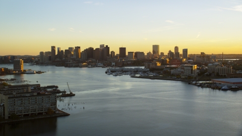 AX146_075.0000302F - Aerial stock photo of The Charles River and city skyline of Downtown Boston, Massachusetts, sunset