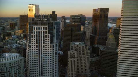 AX146_085.0000236F - Aerial stock photo of Tall skyscrapers in Downtown Boston, Massachusetts, sunset