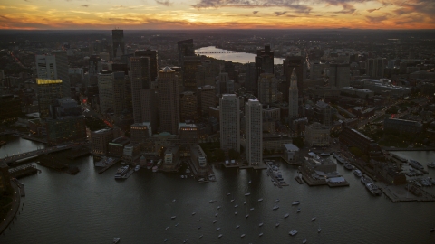 AX146_127.0000319F - Aerial stock photo of Waterfront skyscrapers at twilight in Downtown Boston, Massachusetts