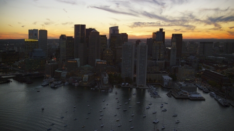 AX146_134.0000208F - Aerial stock photo of Rowes Wharf and skyscrapers at twilight, Downtown Boston, Massachusetts