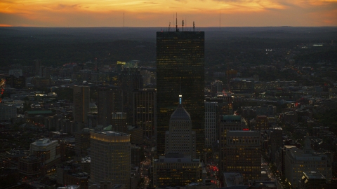 AX146_142.0000169F - Aerial stock photo of A tall skyscraper at twilight in Downtown Boston, Massachusetts