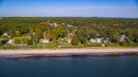 AX147_058.0000143 - Aerial stock photo of Beachfront mansions and fall foliage, autumn, Beverly, Massachusetts