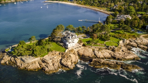 AX147_062.0000375 - Aerial stock photo of An oceanfront mansion by Lobster Cove, Manchester-by-the-Sea, Massachusetts