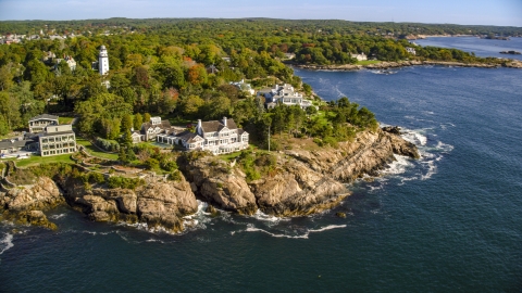 AX147_063.0000000 - Aerial stock photo of Oceanfront mansions and trees with fall foliage, Manchester-by-the-Sea, Massachusetts