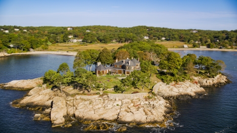 AX147_077.0000061 - Aerial stock photo of An isolated, oceanfront mansion, Manchester-by-the-Sea, Massachusetts