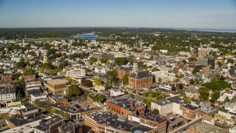 AX147_104.0000079 - Aerial stock photo of City hall in the middle of the town of Gloucester, Massachusetts