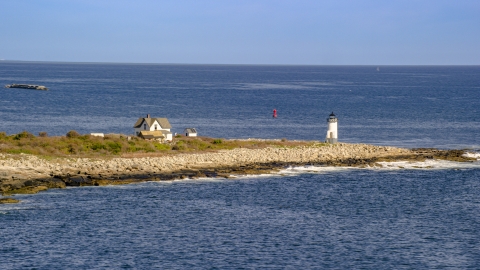 AX147_116.0000000 - Aerial stock photo of A lighthouse on Straitsmouth Island, Rockport, Massachusetts