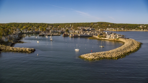 AX147_118.0000186 - Aerial stock photo of A small harbor and a coastal town, Rockport, Massachusetts