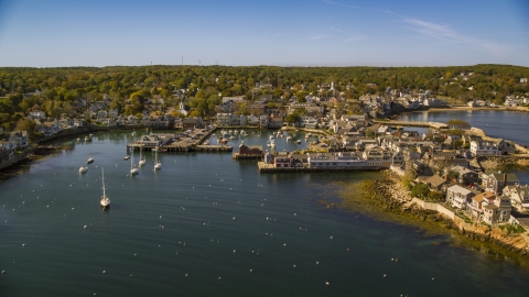 AX147_119.0000000 - Aerial stock photo of A small coastal town beside a harbor, Rockport, Massachusetts