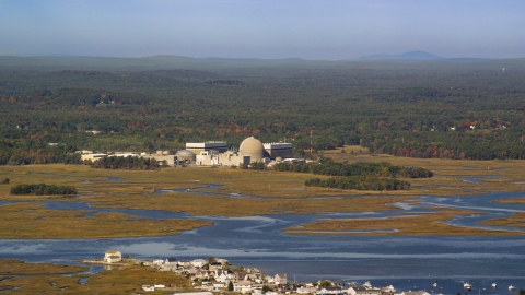 AX147_152.0000148 - Aerial stock photo of A nuclear power plant near the water in autumn, Seabrook, New Hampshire