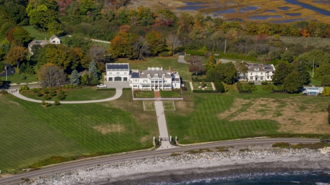 AX147_160.0000171 - Aerial stock photo of A view of an oceanfront mansion in autumn, North Hampton, New Hampshire