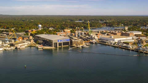 AX147_174.0000197 - Aerial stock photo of A naval shipyard in autumn, Kittery, Maine