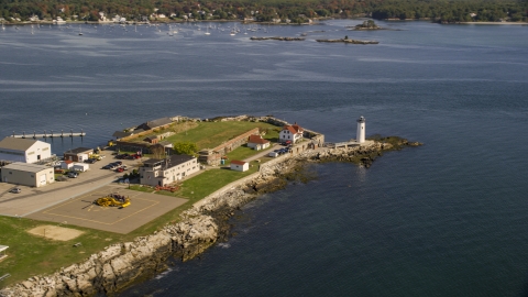 AX147_192.0000271 - Aerial stock photo of Lighthouse and fort on New Castle Island in autumn, New Castle, New Hampshire