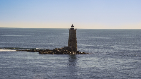 AX147_194.0000204 - Aerial stock photo of A lighthouse with the ocean in the background, Kittery, Maine