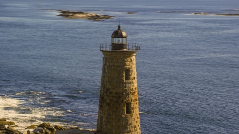AX147_195.0000122 - Aerial stock photo of The top of a lighthouse by the water, Kittery, Maine
