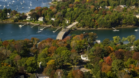 AX147_226.0000150 - Aerial stock photo of A small bridge and colorful autumn trees, Kittery, Maine