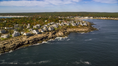 AX147_244.0000114 - Aerial stock photo of A coastal town on a rocky shore in autumn, York, Maine