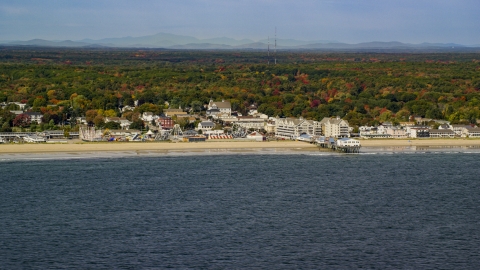 AX147_296.0000085 - Aerial stock photo of A beach, pier and Palace Playland in autumn, Old Orchard Beach, Maine